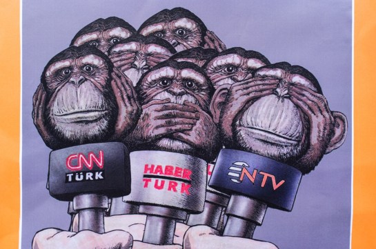 Commentary on coverage of the Gezi Park occupation and related demonstrations, part of an exhibition of political cartoons, Gezi Park encampment, early-June, 2013. (Fuji X100). (Click on photo for larger image.) 