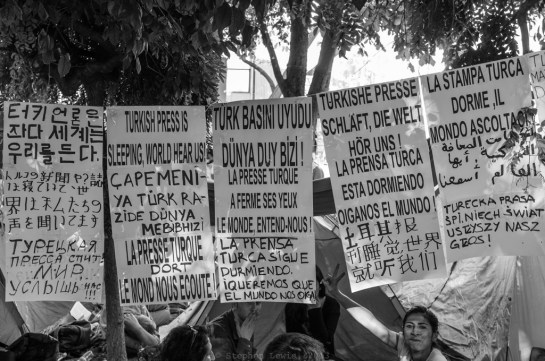An appeal to the world's press, apparently in as many languages as the young people responsible could muster on short notice, Gezi Park occupation, Istanbul, first half of June, 2013. (Fuji X100) (Click on image to enlarge.)