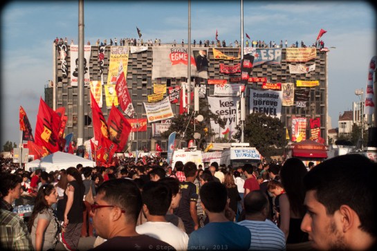 Atatürk Cultural Center, Taksim Square, Istanbul, occupied and bedecked with banners of left wing groups, early-June 2013. (Canon G10) (Click on photo for larger image.)