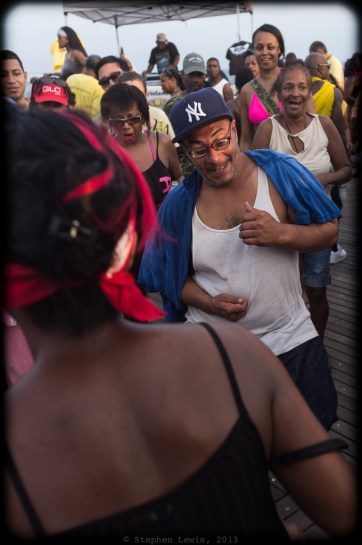 Dancers at a weekend afternoon dance party, Coney Island Boardwalk, Brooklyn, New York, 2012. (Fuji X100 w/28mm-equivalant lens adapter). Click to enlarge.