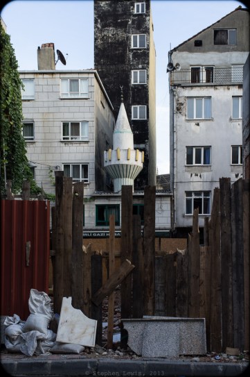 Minaret surrounded by nondescript concrete structures, Kasım Paşa, Istanbul, 2012. (Fuji X100) Click to enlarge.