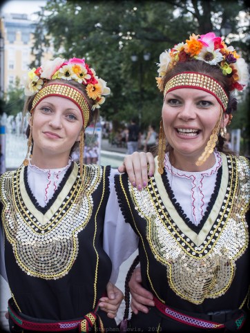 Two members of an amateur folk dance troupe following a performance at an outdoor dance event for children, downtown Sofia, Bulgaria, 2013. (Fuji X100, vertical crop from horizontal frame) Click to enlarge.