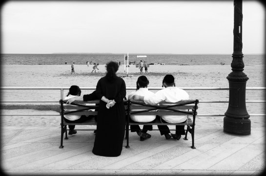A Brighton Beach sabbath afternoon. Ultra-orthodox Jews gazing at volley ball and the horizon; Brighton Beach, Brooklyn, New York, 2012. (Fuji X100). Click to enlarge.