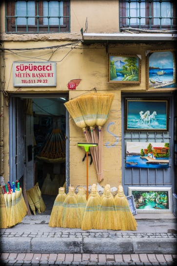 Left: The wares of a broom seller with matching façade. Right: Affordable art.  Tahtakale, Eminönü, Istanbul, 2012. (Fuji X100). Click to enlarge.