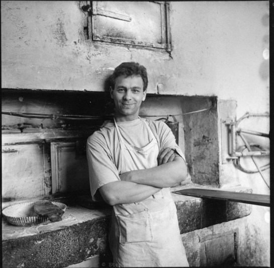 Baker, side-street of Women's Market, Sofia, Bulgaria, 1997. (Rolleiflex f3.5 Tessar, Tri-X, 400 ASA, scan of print). Click to enlarge.