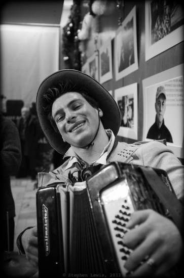 Music at the premiere was provided by a high-spirited, virtuoso Roma (Gypsy) accordionist, with the very non-Bulgarian, non-Roma name of "Jimmy."  Jimmy reinforces his seemingly American moniker with a seemingly American cowboy hate.  Johnny invited Jimmy to the premiere after hearing him play on the street nearby.  It was Jimmy's fault that I danced rather than photographed! (Fuji X100, specs as per above). Click on image to enlarge. 